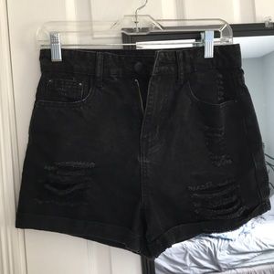 black ripped jean shorts